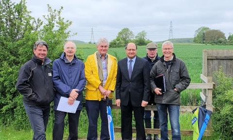 Shailesh Vara MP, Cllr David Over and residents in the village of Helpston