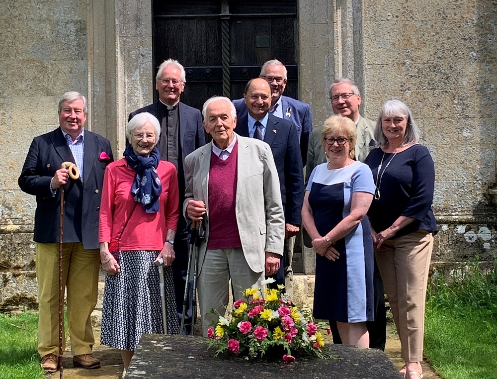 Shailesh Vara MP with Trustees and Advisory Council in front of the church and behind Nicholas Ferrar’s table tomb.